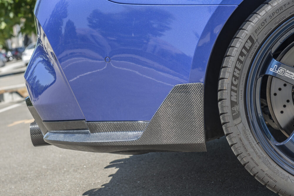Technica AP 2021-2025 BMW G82 G83 Carbon Fiber M-Performance Rear Apron Lip Splitter - Image 3